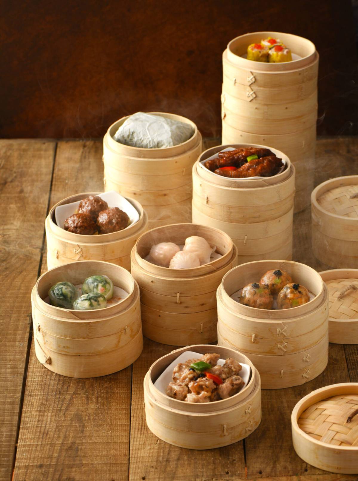 steamed bamboo baskets containing coloured dimsum