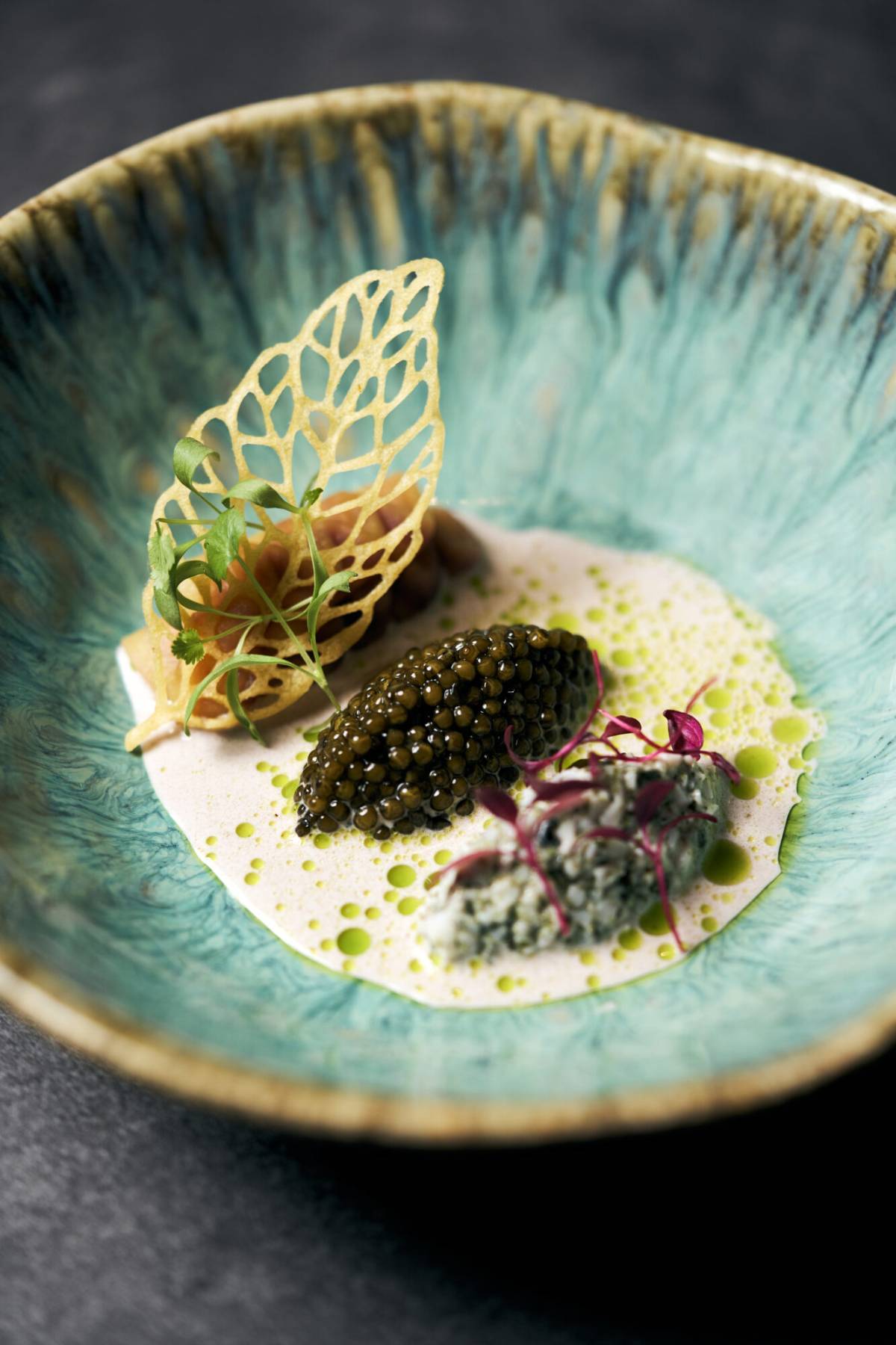 peruvian dish with kaluga caviar in a blue plate