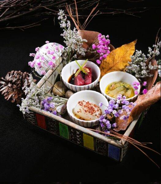 raw sea food presented on a platter kaiseki style